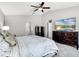 Bedroom with neutral color scheme, carpet, and television at 140 Elgin Blvd, Davenport, FL 33897