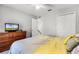This bedroom features a ceiling fan and a dresser at 140 Elgin Blvd, Davenport, FL 33897