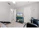 Cozy bedroom with mounted tv and a stationary bike for in-home workouts at 140 Elgin Blvd, Davenport, FL 33897