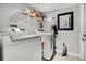 Functional laundry room with modern washer and dryer, storage shelves, and ample space at 140 Elgin Blvd, Davenport, FL 33897