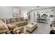 Inviting living room features stylish decor, modern flooring, and an open layout leading to the kitchen at 140 Elgin Blvd, Davenport, FL 33897
