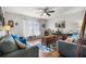 Inviting living room featuring hardwood floors, comfortable seating, and ample natural light at 140 Elgin Blvd, Davenport, FL 33897