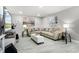 Comfortable living room with plush sofas, decorative pillows, and stylish decor at 140 Elgin Blvd, Davenport, FL 33897