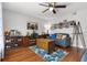 Comfortable living room with hardwood floors and a ceiling fan at 140 Elgin Blvd, Davenport, FL 33897