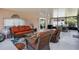 Enjoy your evenings on this spacious screened-in patio with comfortable seating and stylish decor at 140 Elgin Blvd, Davenport, FL 33897