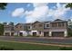 Charming row of modern townhouses with gray siding, stone accents, and attached garages at 14938 Harvest St, Orlando, FL 32824