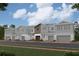 Charming row of modern townhouses with gray siding, stone accents, and attached garages at 14938 Harvest St, Orlando, FL 32824