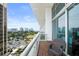 Comfortable seating on a private balcony overlooking the lake and city skyline at 150 E Robinson St # 717, Orlando, FL 32801