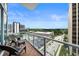 A relaxing balcony with seating overlooking beautiful city views at 150 E Robinson St # 717, Orlando, FL 32801