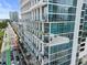 Modern condo building featuring floor-to-ceiling windows and balconies, offering stunning city views and upscale living at 150 E Robinson St # 717, Orlando, FL 32801