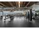 Spacious gym with state-of-the-art equipment and exposed ductwork, promoting a healthy lifestyle and convenient workout options at 150 E Robinson St # 717, Orlando, FL 32801