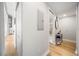 A hallway leading to bathroom with neutral paint and wood-look laminate flooring at 150 E Robinson St # 717, Orlando, FL 32801