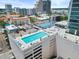 Rooftop pool with lounge chairs, offering a luxurious oasis with city views, ideal for relaxation and recreation at 150 E Robinson St # 717, Orlando, FL 32801