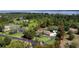 Aerial view showing the property's borders, home, and surrounding green landscape at 15305 Shady Ln, Tavares, FL 32778