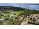Acreage with a beautiful single-Gathering home highlighted with red boundary lines and lake views at 15305 Shady Ln, Tavares, FL 32778