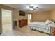 Comfortable bedroom with tile floors, ceiling fan, and closet at 15305 Shady Ln, Tavares, FL 32778