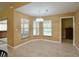 Bright breakfast nook area with tile floors and large windows overlooking the backyard pool area at 15305 Shady Ln, Tavares, FL 32778