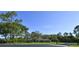 Charming single story home featuring mature trees and a lush lawn at 15305 Shady Ln, Tavares, FL 32778