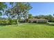 Well-maintained single story home with a spacious front yard at 15305 Shady Ln, Tavares, FL 32778