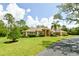 Lovely single-story home with a well-maintained lawn, mature landscaping, and a welcoming front facade at 15305 Shady Ln, Tavares, FL 32778