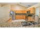 Well-equipped kitchen with granite countertops, stainless steel appliances, and ample cabinet space at 15305 Shady Ln, Tavares, FL 32778