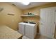 Functional laundry room with modern washer and dryer appliances at 15305 Shady Ln, Tavares, FL 32778