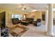 Spacious living room featuring tile floors, neutral walls, and sliding glass doors at 15305 Shady Ln, Tavares, FL 32778
