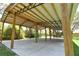 This spacious parking structure features a metal roof and a concrete floor at 15305 Shady Ln, Tavares, FL 32778