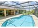 Beautiful pool area featuring clear blue water and a spacious screened-in enclosure at 15305 Shady Ln, Tavares, FL 32778