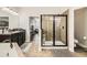 Bathroom with shower, soaking tub, dark cabinetry, and neutral tile at 15465 Heron Hideaway Cir, Winter Garden, FL 34787