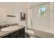 Bathroom featuring tub/shower and dark vanity with bright natural light at 15465 Heron Hideaway Cir, Winter Garden, FL 34787