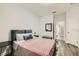 A tranquil bedroom features hardwood floors and a cozy rug at 15465 Heron Hideaway Cir, Winter Garden, FL 34787