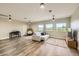 Large bonus room area features modern floors, furniture, and window views at 15465 Heron Hideaway Cir, Winter Garden, FL 34787