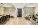 Spacious foyer with high ceilings, wood-look tile flooring, and ample natural light from the front windows at 15465 Heron Hideaway Cir, Winter Garden, FL 34787