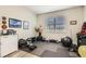 Home gym featuring rubber flooring, ample equipment, and a bright window at 15465 Heron Hideaway Cir, Winter Garden, FL 34787
