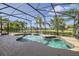 Private pool with a screened-in lanai with lush tropical landscaping and tranquil water views at 15465 Heron Hideaway Cir, Winter Garden, FL 34787
