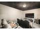 Home theater with comfortable seating, large screen, and modern fixtures at 15465 Heron Hideaway Cir, Winter Garden, FL 34787