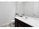 Powder room featuring a modern vanity, toilet, and neutral color scheme at 15485 Sandfield Loop, Winter Garden, FL 34787