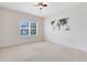 Bright bedroom with a ceiling fan, world map wall decor, and natural light from a window at 15485 Sandfield Loop, Winter Garden, FL 34787