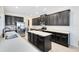 Spacious kitchen with stainless steel appliances, lots of cabinet space, and a large kitchen island at 15485 Sandfield Loop, Winter Garden, FL 34787