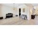 Elegant living area with a piano, stylish furniture, and an inviting atmosphere at 15485 Sandfield Loop, Winter Garden, FL 34787