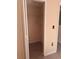 A compact closet with shelving and tile flooring offers storage solutions at 1621 Emily Ct, Kissimmee, FL 34744