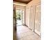 Bright entryway with tiled floor and a view of the front door and closet space at 1621 Emily Ct, Kissimmee, FL 34744
