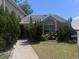 Charming single-story home with well-manicured landscaping and a lovely curved window at 1621 Emily Ct, Kissimmee, FL 34744