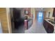 Spacious kitchen boasts sleek black appliances, cherry wood cabinets, and tiled flooring at 1621 Emily Ct, Kissimmee, FL 34744