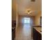 Open living space with tile flooring, ceiling fan, and sliding glass doors to the pool at 1621 Emily Ct, Kissimmee, FL 34744