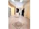Open-concept living space with tile flooring, modern lighting, and kitchen view at 1621 Emily Ct, Kissimmee, FL 34744