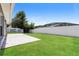 Manicured lawn and fenced backyard with patio at 1653 Turtle Rock Dr, Lakeland, FL 33803
