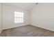 Bedroom with carpet, neutral walls, and a window for natural light at 1653 Turtle Rock Dr, Lakeland, FL 33803