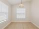 Cozy dining area with tile floors and natural light from large windows at 1653 Turtle Rock Dr, Lakeland, FL 33803